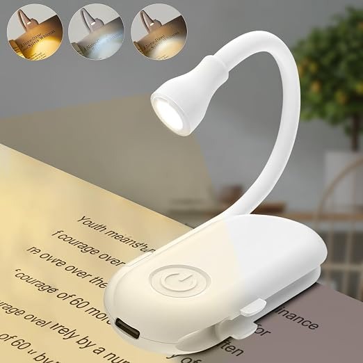 Gesto rechargeable clip-on book reading light illuminating an open book
